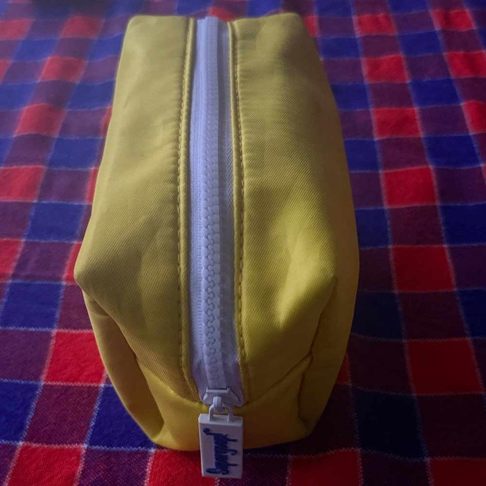 Supergoop! Yellow Pouch with White Zipper